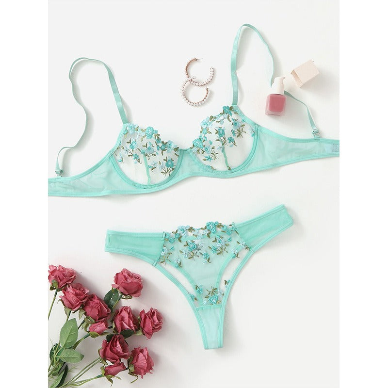 Aqua floral lace lingerie set with embroidered flowers displayed on white background