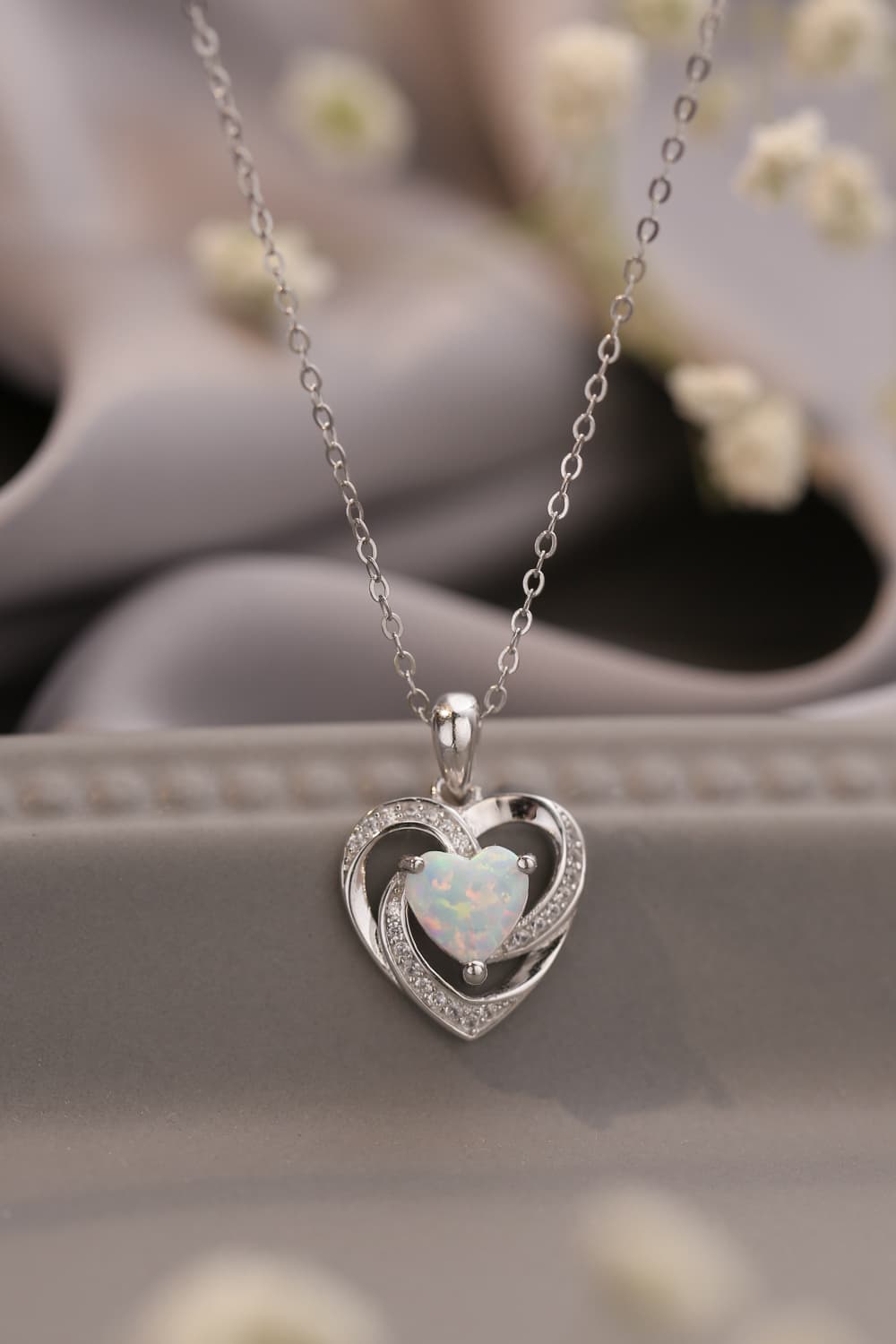 red-desired-opal-heart-necklace-model-closeup